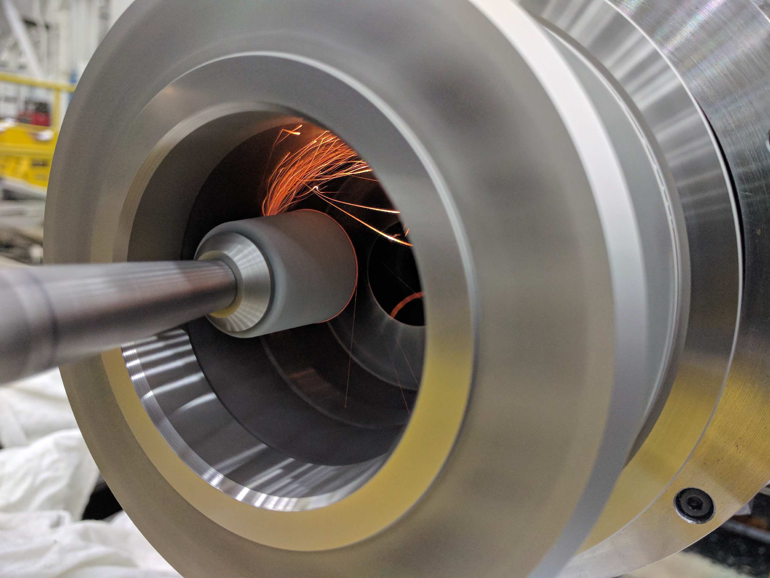 On-site spindle taper grinding operation set up at the machine tool.